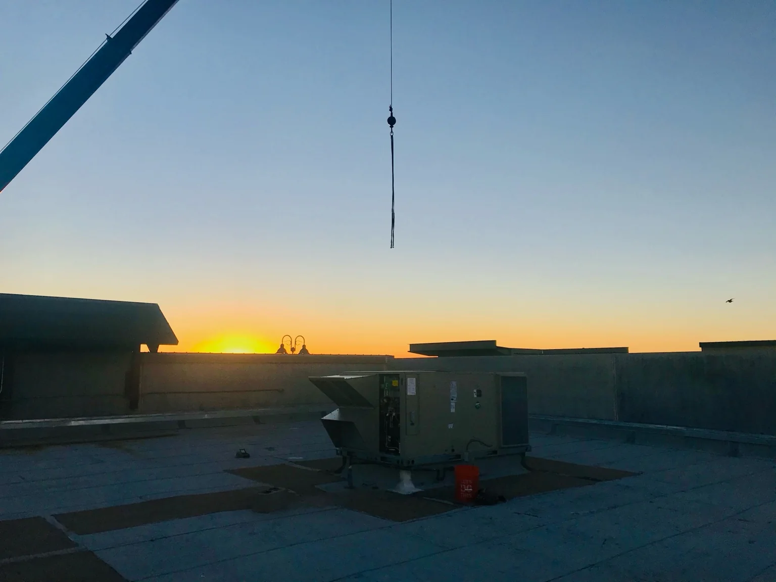 Rooftop change-out work during an extended field window.