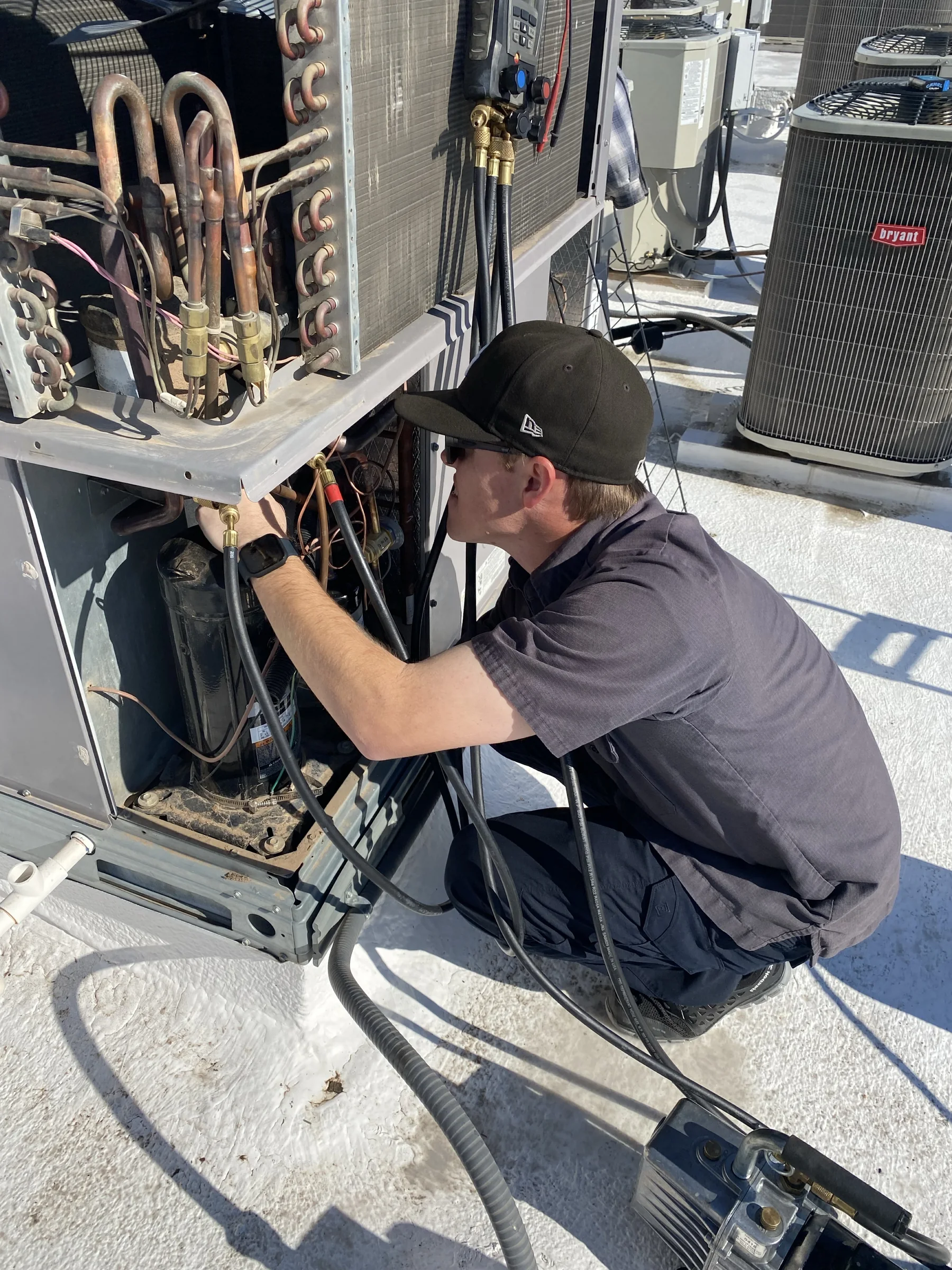 Technician performing detailed HVAC field diagnostics