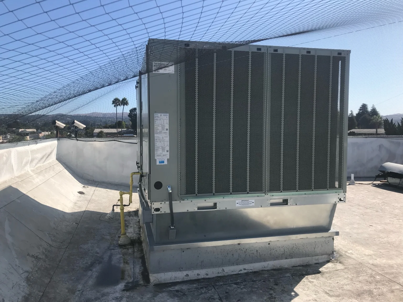 Packaged rooftop equipment in a commercial service environment.