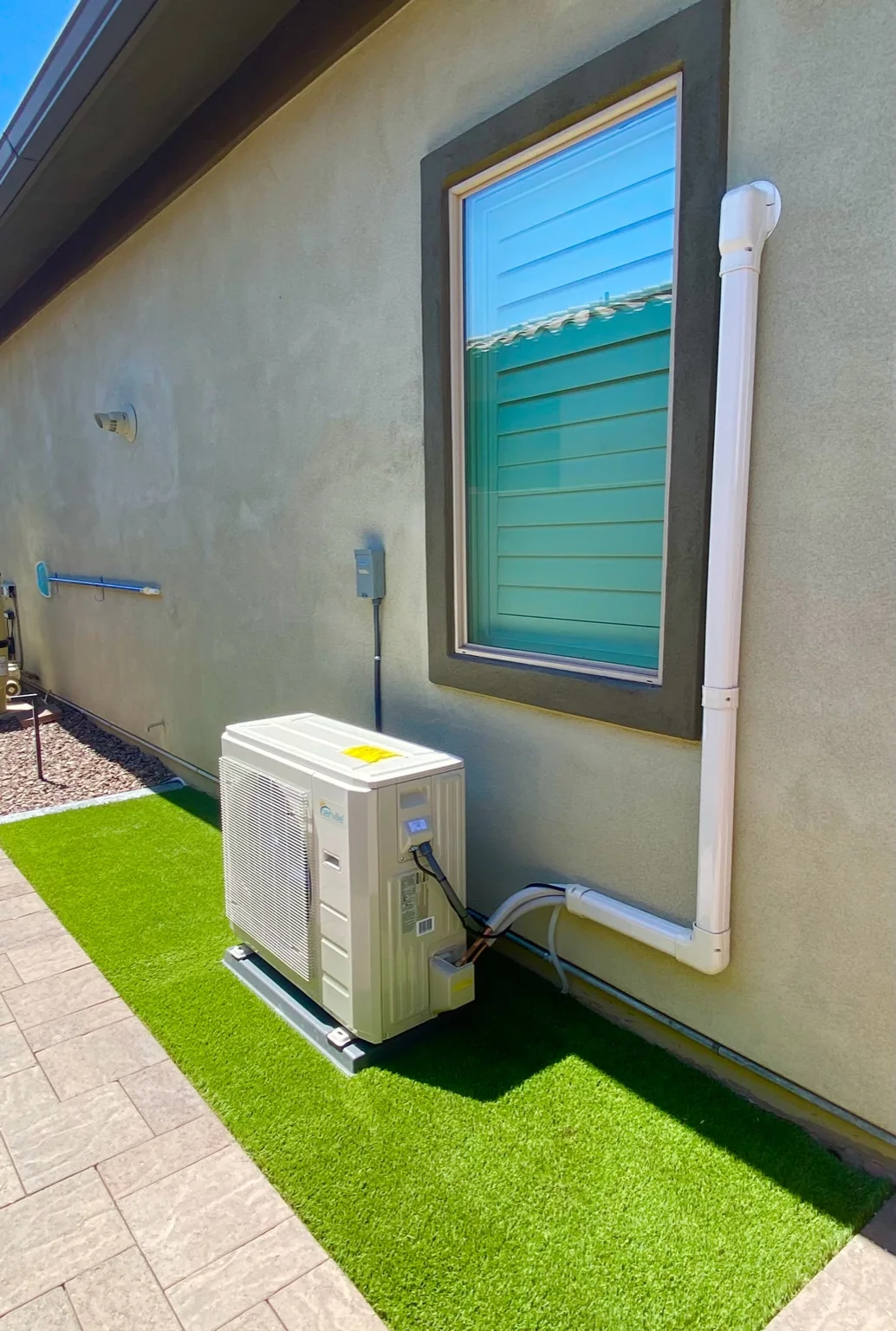 Outdoor mini-split installation with exterior line-set routing.